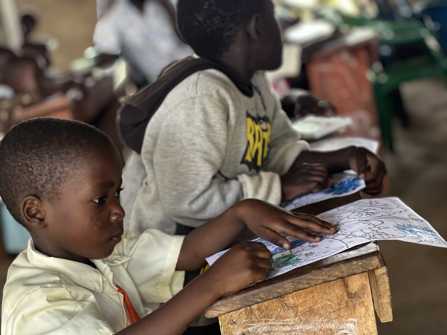 Children coloring during a lesson